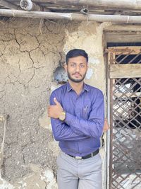 Portrait of young man standing outdoors