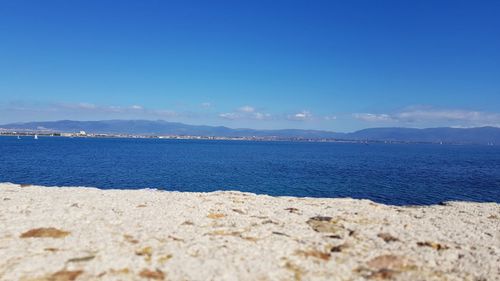 Scenic view of sea against blue sky