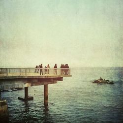 Pier on sea against sky