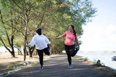 Rear view of couple walking on street