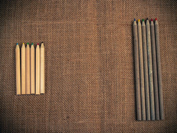 Directly above shot of pencils on burlap
