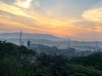 Scenic view of landscape against cloudy sky