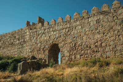 Low angle view of fort against clear sky