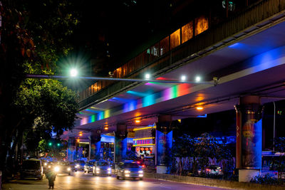 Illuminated city street at night