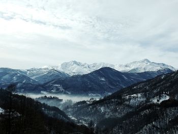 Scenic view of snowcapped mountains against sky