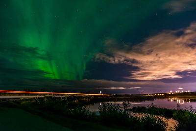 Scenic view of river against sky at night