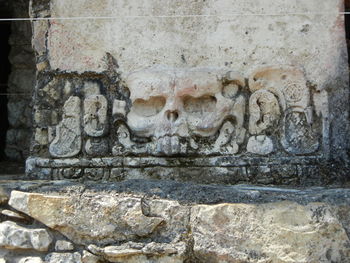 Close-up of carvings on brick wall