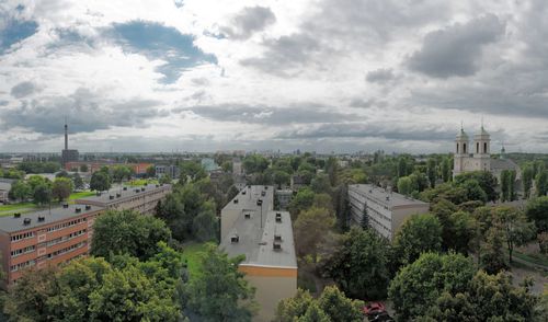 High angle view of trees and buildings against sky