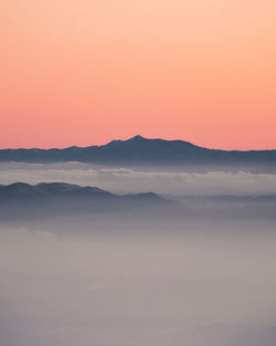 Scenic view of mountains against sky during sunset