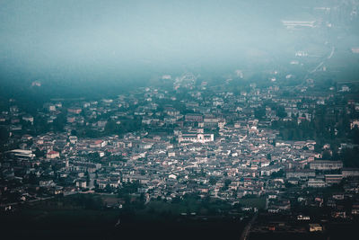 High angle view of illuminated buildings in city