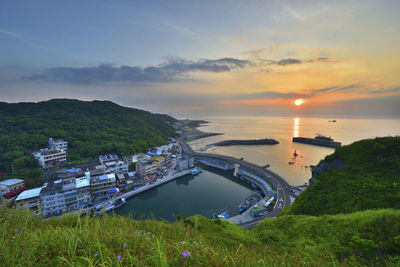 High angle view of sea against sky during sunset