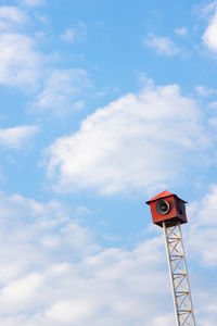 Low angle view of communications tower against sky