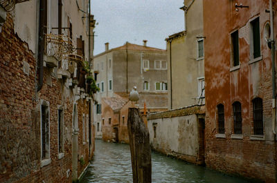 Canal amidst buildings in town
