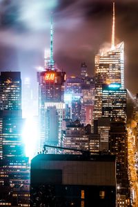 Illuminated buildings in city at night