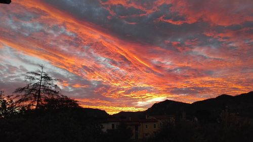 Low angle view of dramatic sky during sunset