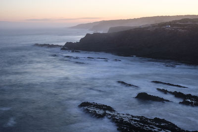 Scenic view of sea against sky during sunset