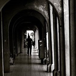 Woman walking in tunnel