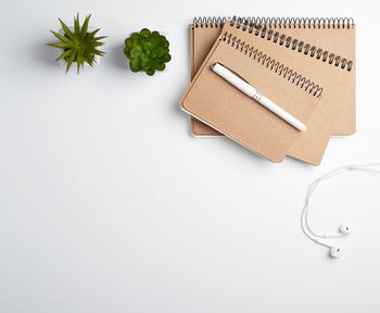 High angle view of pencil on table against white background