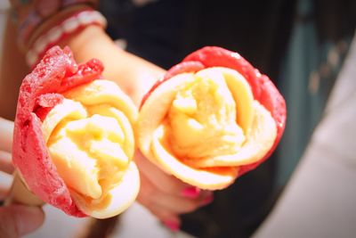 Close-up of hand holding ice cream