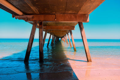 Pier over sea against sky