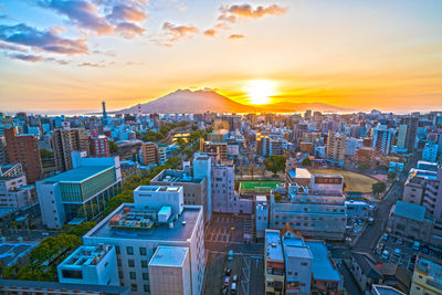 High angle view of city at sunset