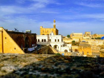 Buildings in city against sky