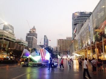 Panoramic view of people on city street