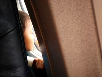 Close-up of girl sleeping in car