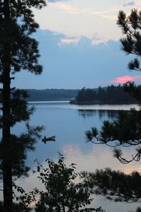 Scenic view of lake against sky during sunset