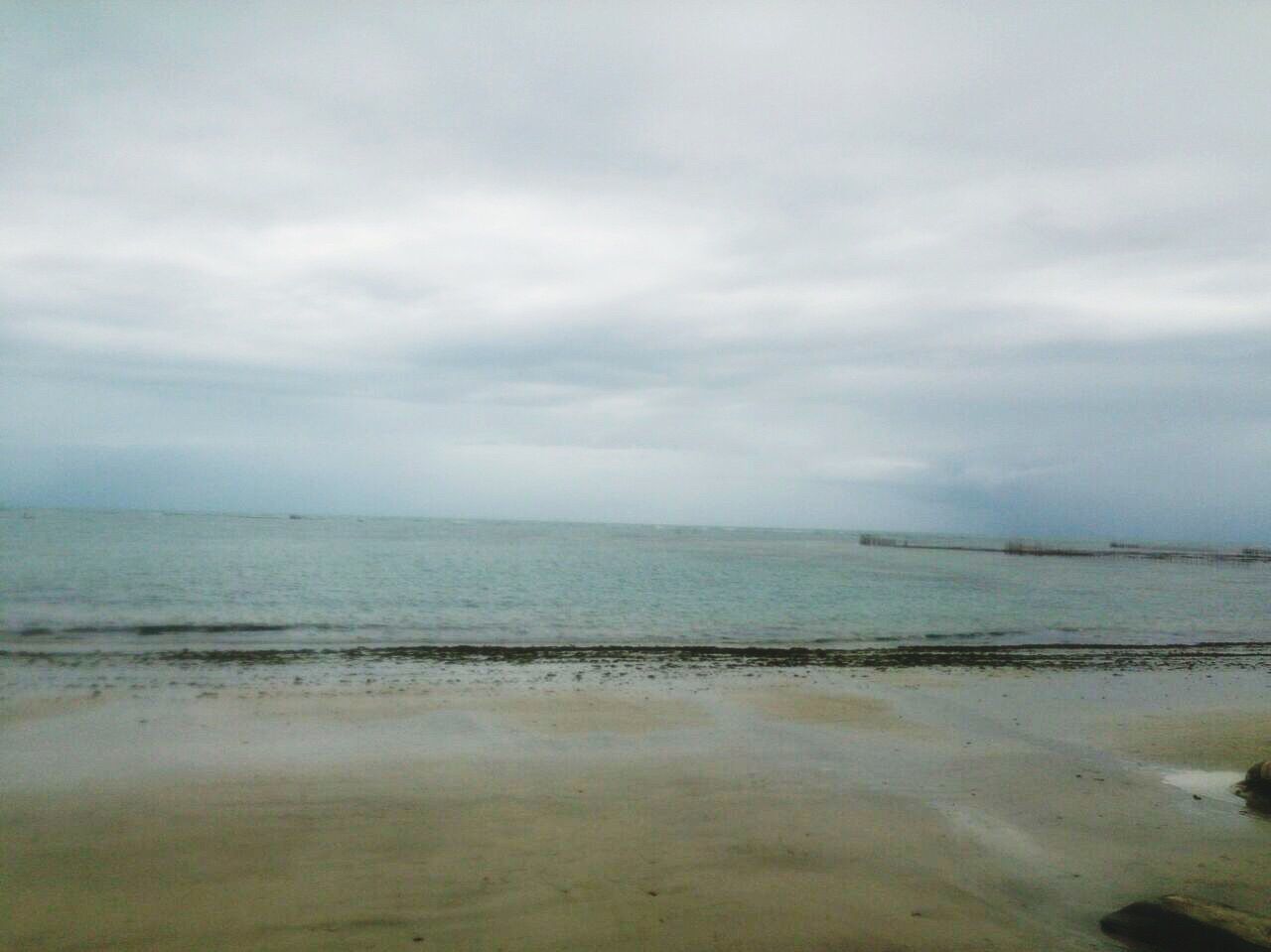 sea, water, horizon over water, beach, sky, tranquil scene, tranquility, scenics, beauty in nature, shore, nature, cloud - sky, sand, idyllic, cloudy, wave, calm, seascape, coastline, cloud