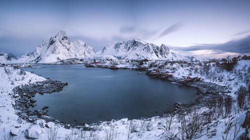 Scenic view of landscape against sky during winter