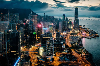 High angle view of illuminated buildings against sky in city