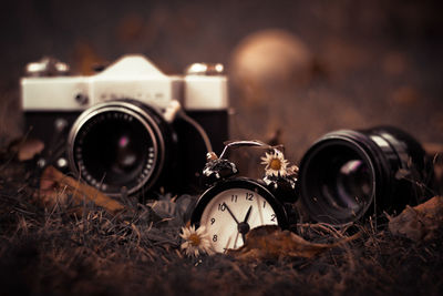 Close-up of clock and camera