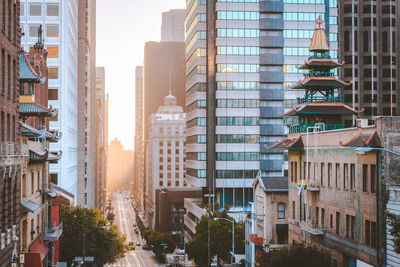 Road amidst buildings in city