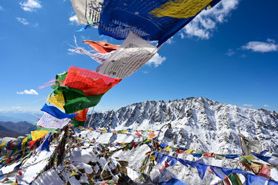 Close up prayers flag at himalayas mountain with snow