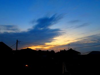 Silhouette bridge against sky at sunset