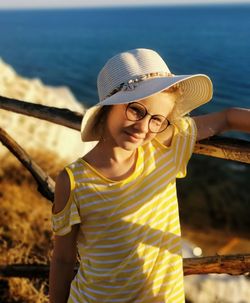 Portrait of smiling young woman in sea