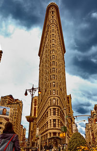 Low angle view of tower against cloudy sky