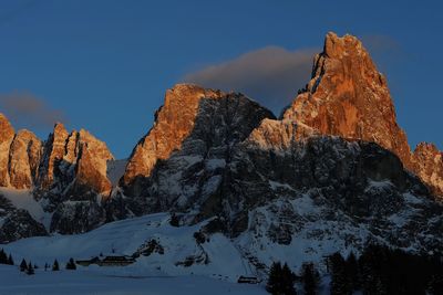 Scenic view of rocky mountains against sky during winter