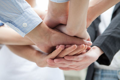 Midsection of couple holding hands