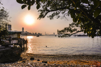 Scenic view of sea against sky at sunset