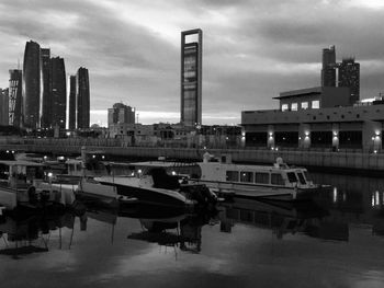 City buildings against cloudy sky