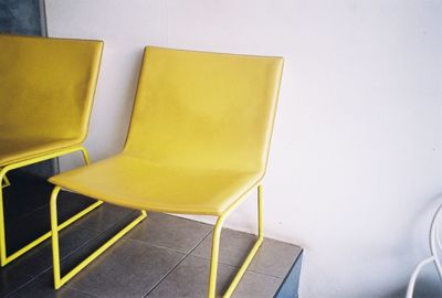 High angle view of yellow chairs on floor