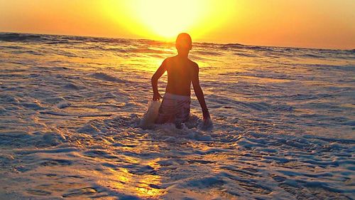 Woman at beach during sunset