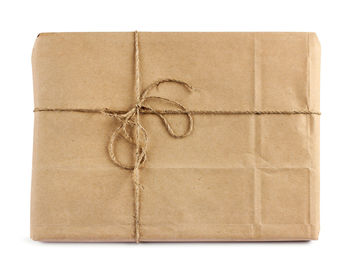 Close-up of box tied on white background