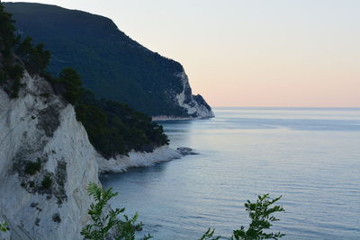 Scenic view of sea against clear sky during sunset