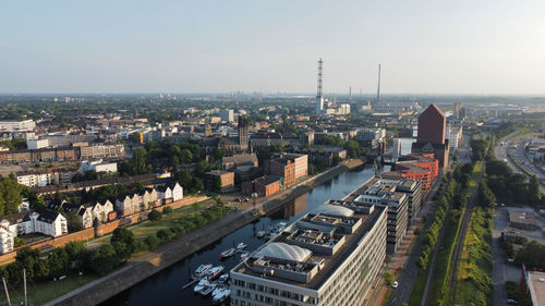 High angle view of buildings in city against sky