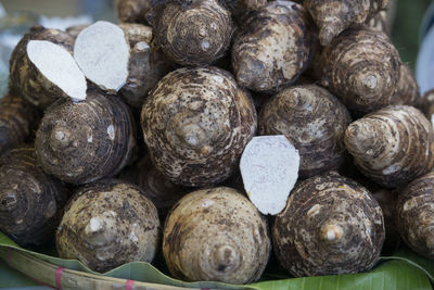 Close-up of cassavas at market stall