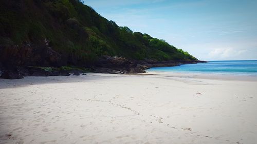 Scenic view of beach against sky