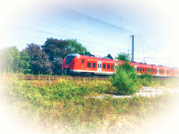 Train on field against sky